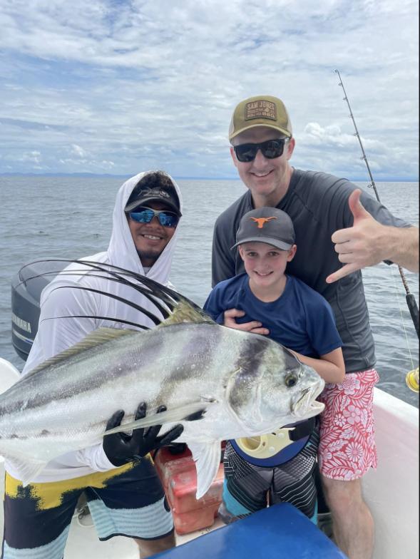 Anglers with a roosterfish caught inshore off Costa Rica's Pacific coast