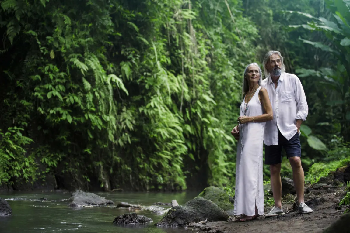 Couple walking a rainforest trail in Costa Rica